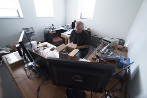 QBTC Office Space - Man working at a desk